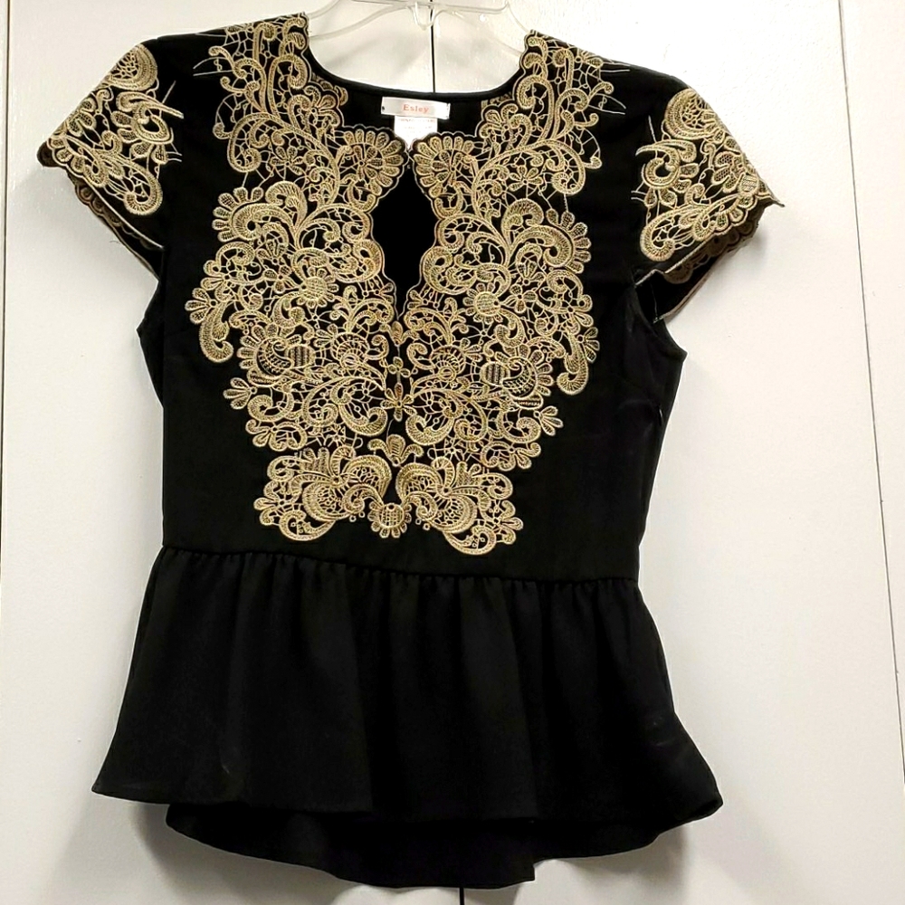 Black peplum top with lace design